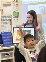 Lindsay Titus receiving her Golden Apple
